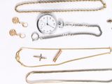 many different types of necklaces and watches on the table