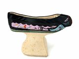 a black shoe with a colorful design on it