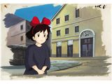 anime scene of a girl with a red bow standing in front of a building