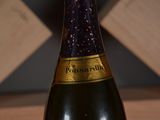 a bottle of wine that is sitting on a table