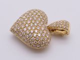 a yellow gold heart shaped pendant with diamonds on a white background