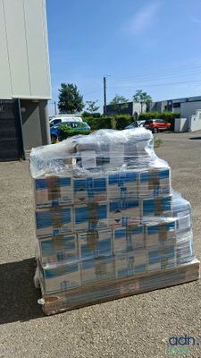 a pallet full of water sitting in a parking lot