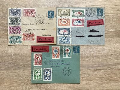 several different types of stamps are laid out on a wooden surface