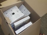a box full of electronic devices sitting on the floor