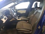 the interior of a blue car with a steering wheel and a dashboard