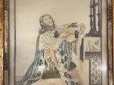 an old picture of a woman sitting on a chair in a room