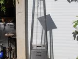 une photo d'un chauffage de terrasse installé dans le jardin