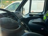 a view of the inside of a van from the driver ' s seat