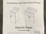 the instruction manual for the electric fryer is on the table