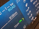 a close up of a car dashboard with a clock on it
