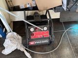 a black and red machine that is on the floor