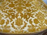 an image of a chair with a yellow and white upholstered seat