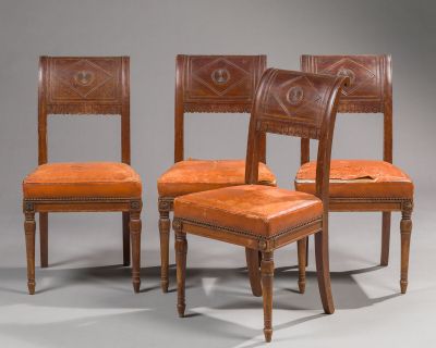 three chairs with leather upholstered backs and a wooden frame