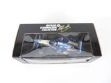 a box with a toy airplane in it on a white surface