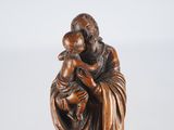an image of a statue of a man holding a child