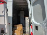 a white van with a bunch of boxes in the back