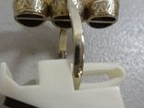 a pair of bells that are sitting on top of a white object