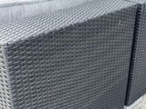 a couch that is sitting on the concrete ground