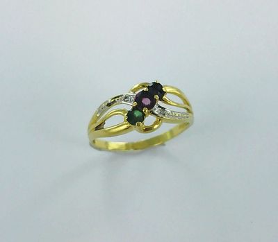 a close up of a gold ring with a green and pink stone