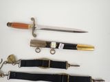 several different types of knives are displayed on a white surface