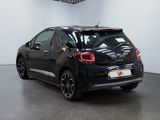 a picture of a black car parked in a showroom
