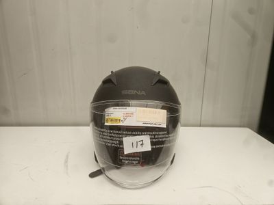 an image of a helmet on a table with a tag on it