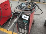 a lot of welding equipment on the ground in the parking lot