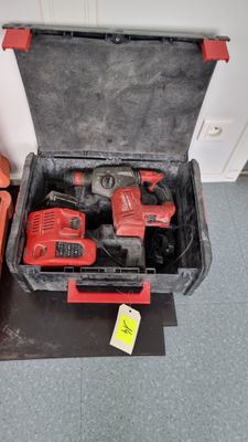 two tools in a case sitting on the floor