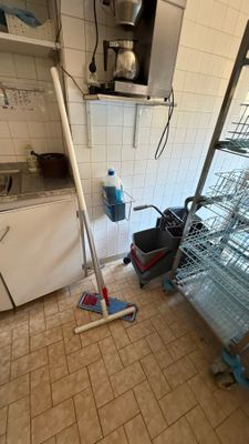 a kitchen with a lot of dishes on the shelves