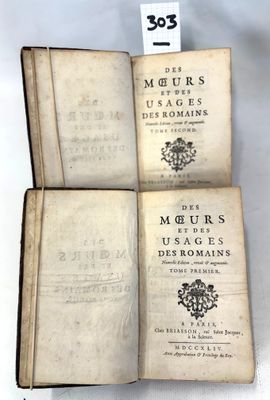 three open books sitting on top of each other on a table