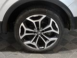 a close up view of a car ' s wheel on the floor
