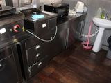 a kitchen with a sink, microwave, and other appliances