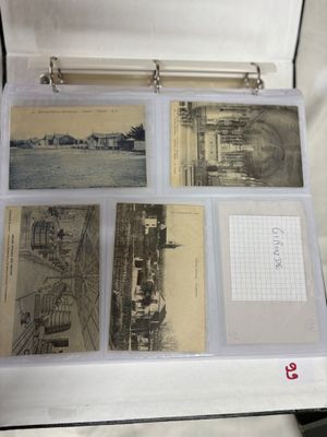 an open suitcase with a bunch of old photos inside of it