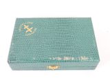 an image of a green box with a gold cross on it