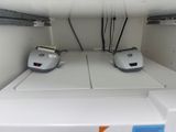 two machines sitting on top of a white counter