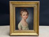 portrait of a young girl in a white dress in a gold frame