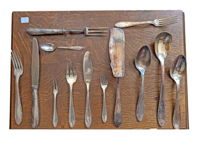 a wooden table topped with silverware and silverware