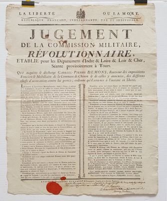 un morceau de papier portant un cachet de cire rouge