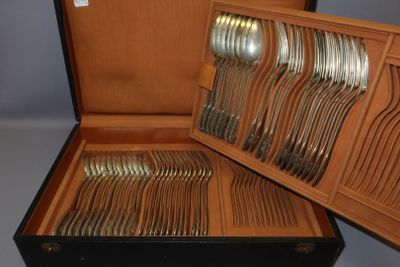 a wooden box with a bunch of silverware in it