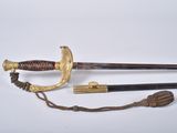 an image of a sword with a wooden handle and a brass handle