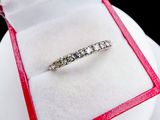 a diamond ring in a red box on a white plate