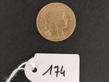 a close up of a coin with a price tag attached to it