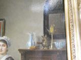 un tableau représentant une femme assise devant une commode