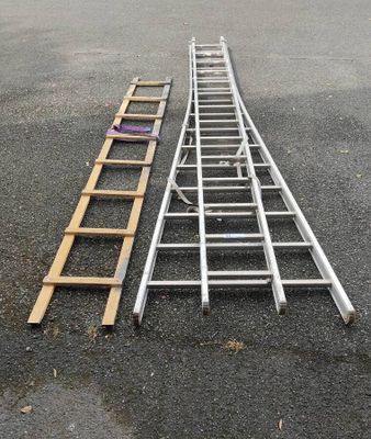 two ladders that are laying on the ground