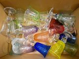 a box full of different colored glass vases in it