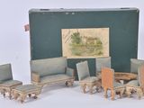a doll house living room set with chairs and a table