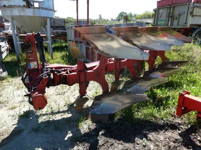 an image of a tractor plow in a field