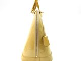 yellow handbag on white background with zippers and a white background