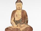 statue d'un Bouddha assis sur une surface blanche