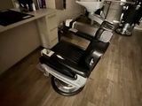 an image of a hair salon with a row of chairs